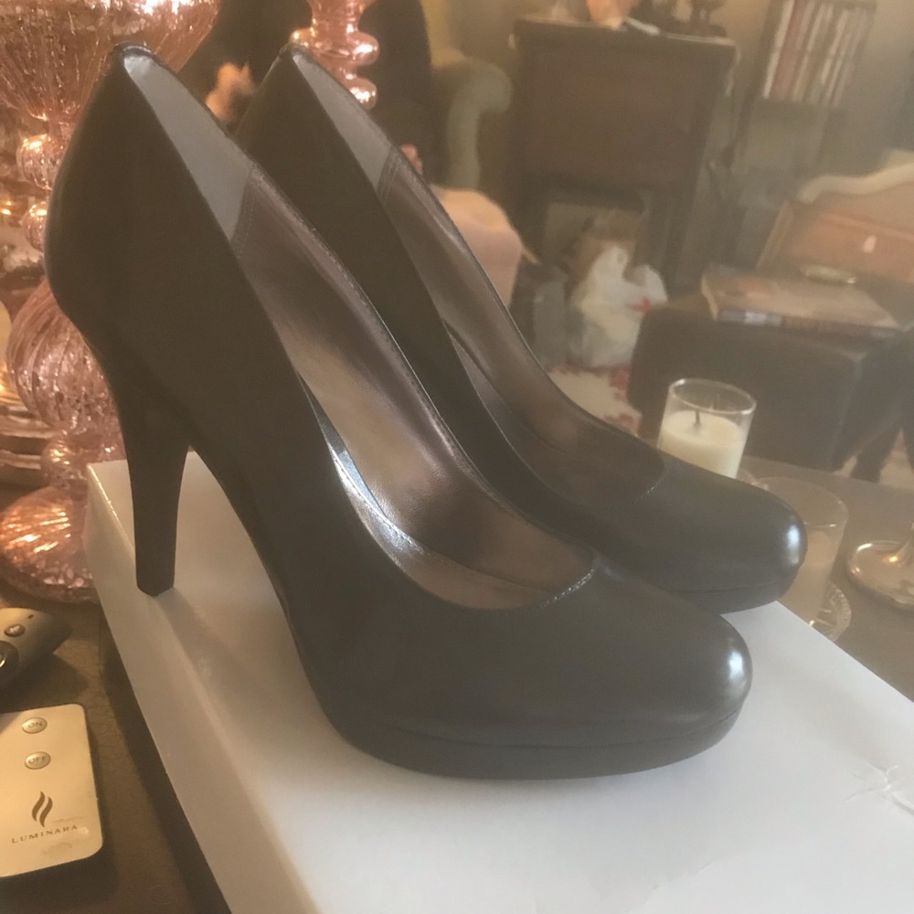 Black leather pumps